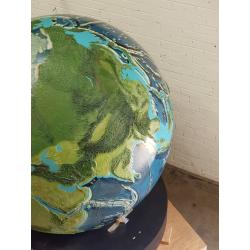 A unique 78 inches (2 meters) diameter relief globe shows the physical features under the oceans.