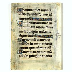 Page from a Psalter with historiated miniature of Christ enthroned, blessing with outstretched arms, as Salvator Mundi.