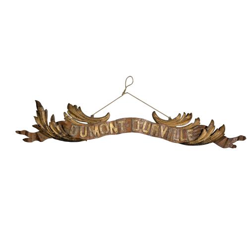 Transom of a ship in gilded carved wood bearing the inscription "DUMONT- DURVILLE"