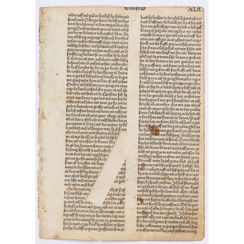 Page from a printed bible with wood block print of St. Anthony the Abbot defeated the devil.