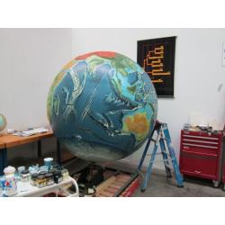 A unique 78 inches (2 meters) diameter relief globe shows the physical features under the oceans.