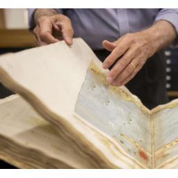 How does paper condition affect the value of old maps and prints?